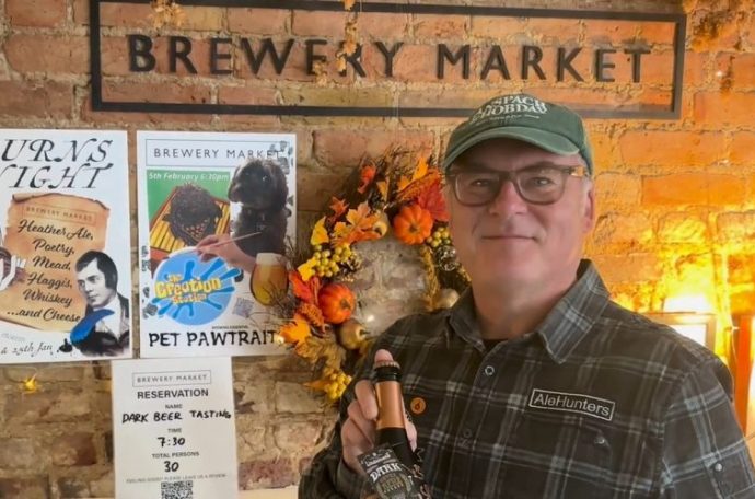 Ale Hunters founder Paul Davies poses with one of his favourite craft beers.