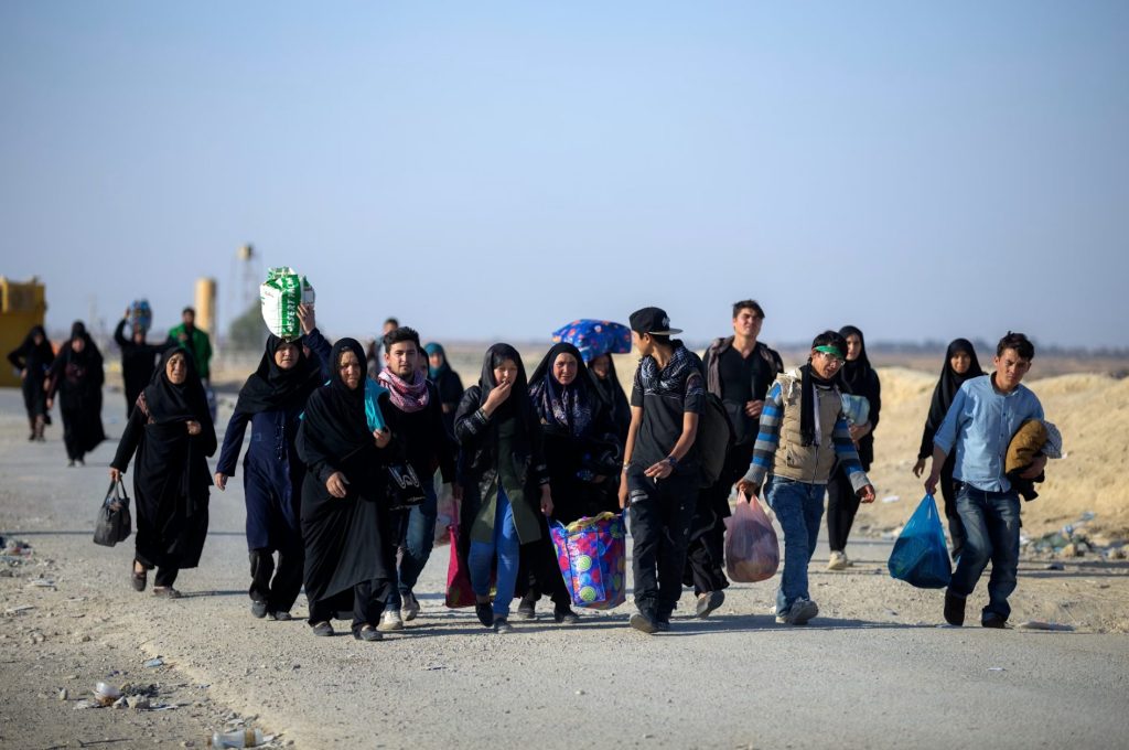 Refugees leaving home with just a bag each