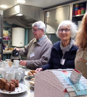 Volunteers serve cakes and tea at the Twickenham Repair Cafe.