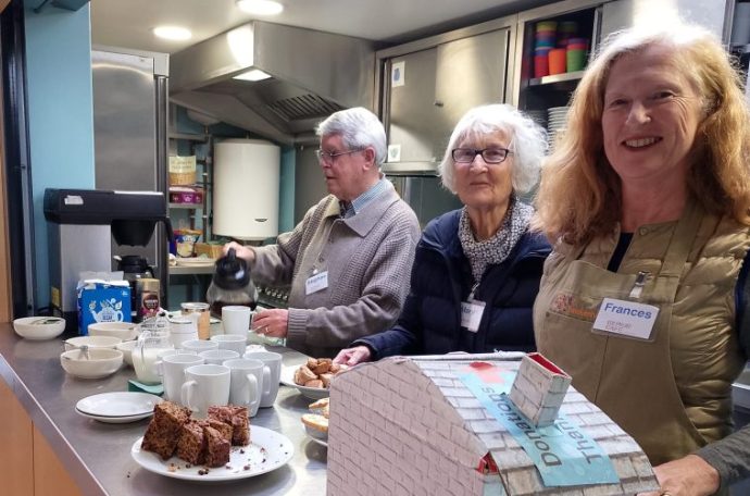 Volunteers serve cakes and tea at the Twickenham Repair Cafe.