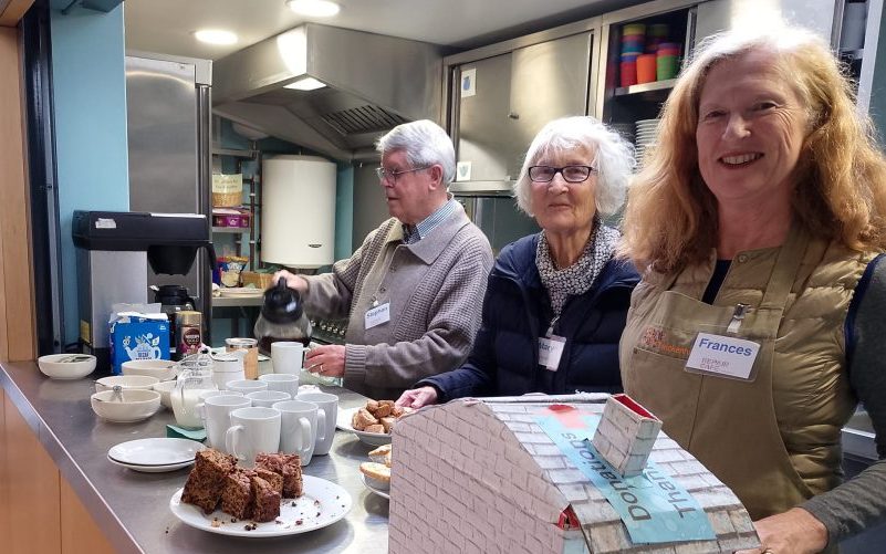 Volunteers serve cakes and tea at the Twickenham Repair Cafe.