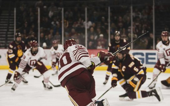 Ice hockey players in a game on the ice rink