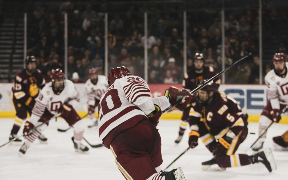 Ice hockey players in a game on the ice rink