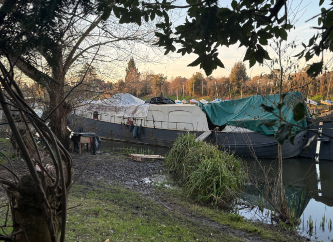 A boat illegally moored on the River Thames in West Molesey