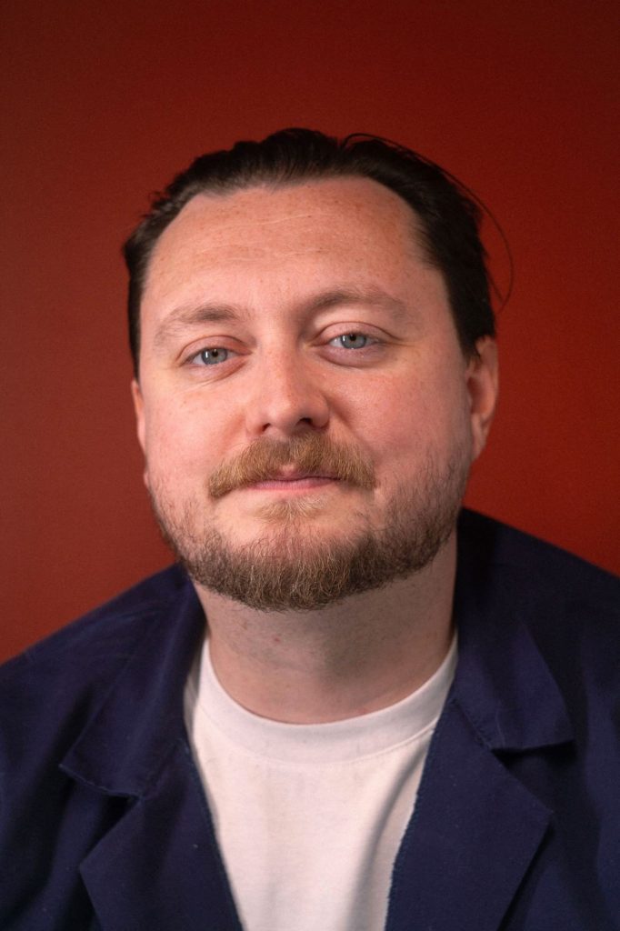 Eli Hart, Headliner of the Armpit Comedy Night and winner of the BBC New Comedy Awards 2025. 
Credit: Croydon and Lambeth Food Bank.