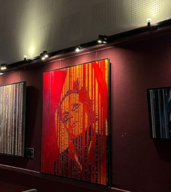 Three of McGinley's oil painting artworks at the Irish Cultural Centre.