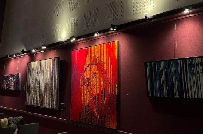 Three of McGinley's oil painting artworks at the Irish Cultural Centre.