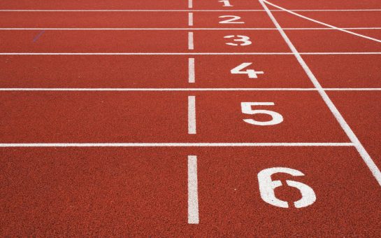 A close up shot of a running track. Image credit: Photo by Austris Augusts via unsplash