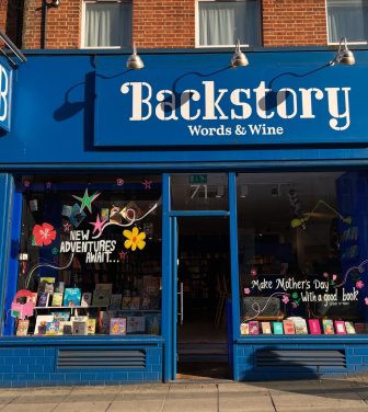 The front of Backstory bookshop with the words 'Word and Wine' clearly shown on the front of the store