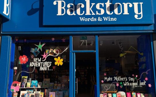 The front of Backstory bookshop with the words 'Word and Wine' clearly shown on the front of the store