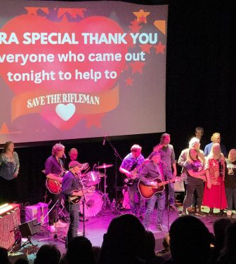 Picture of all the performers on stage at the end of the concert