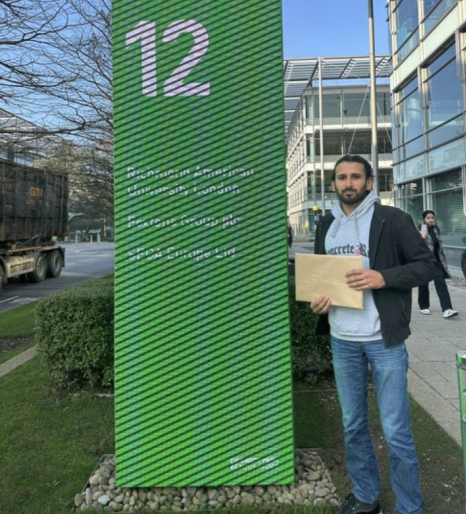 Darius Khan delivering his human rights lawsuit to Sega offices in Chiswick