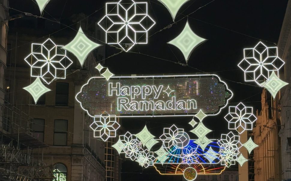 Lights lit up in the streets of Leicester Square.