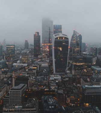 Aerial shot of central London engulfed in fog.