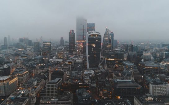Aerial shot of central London engulfed in fog.