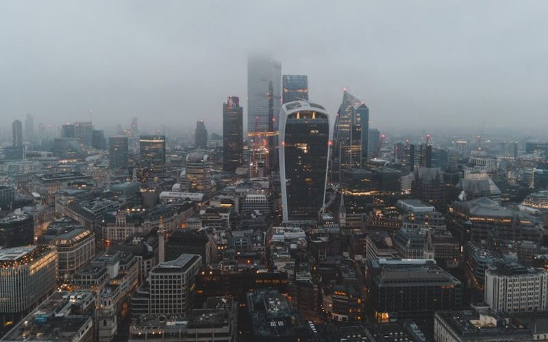 Aerial shot of central London engulfed in fog.