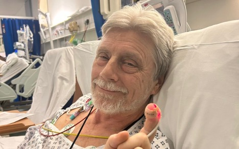 Paul Wickens in hospital bed