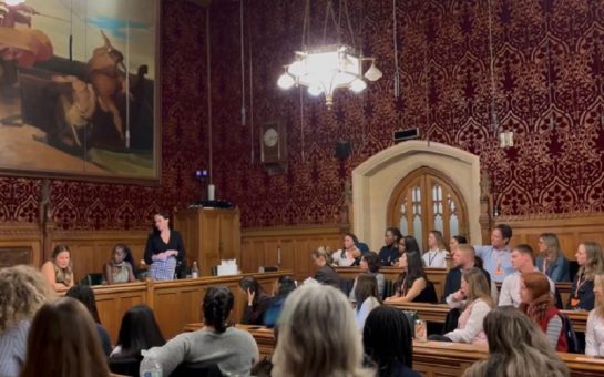 women in parliament listening to speaker MP Natalie Fleet