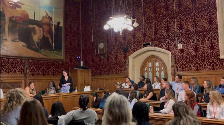 women in parliament listening to speaker MP Natalie Fleet