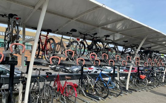A bike rack at a train station