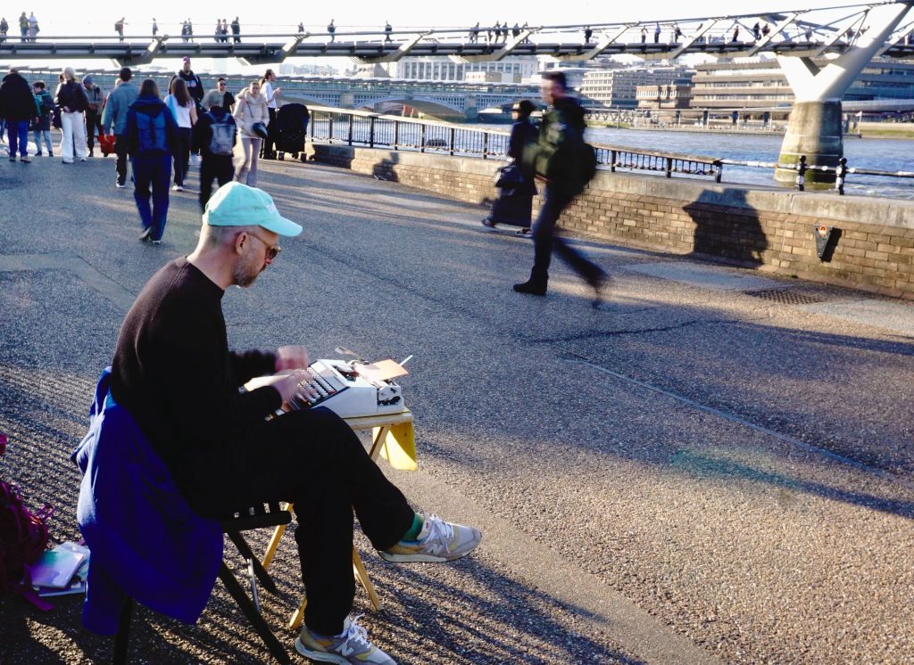 STREET ART: Luke set up to write original poems for passersby on London’s South Bank. Image credit: Louis Greaves