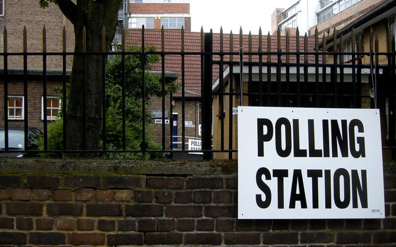 polling station sign on gate