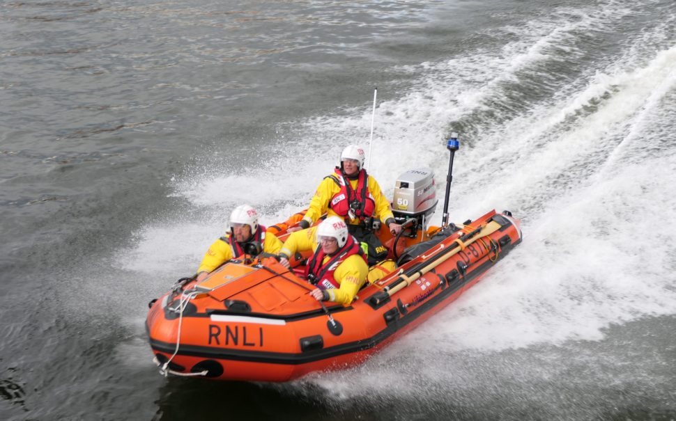 An image of an RNLI lifeboat going out on a rescue.