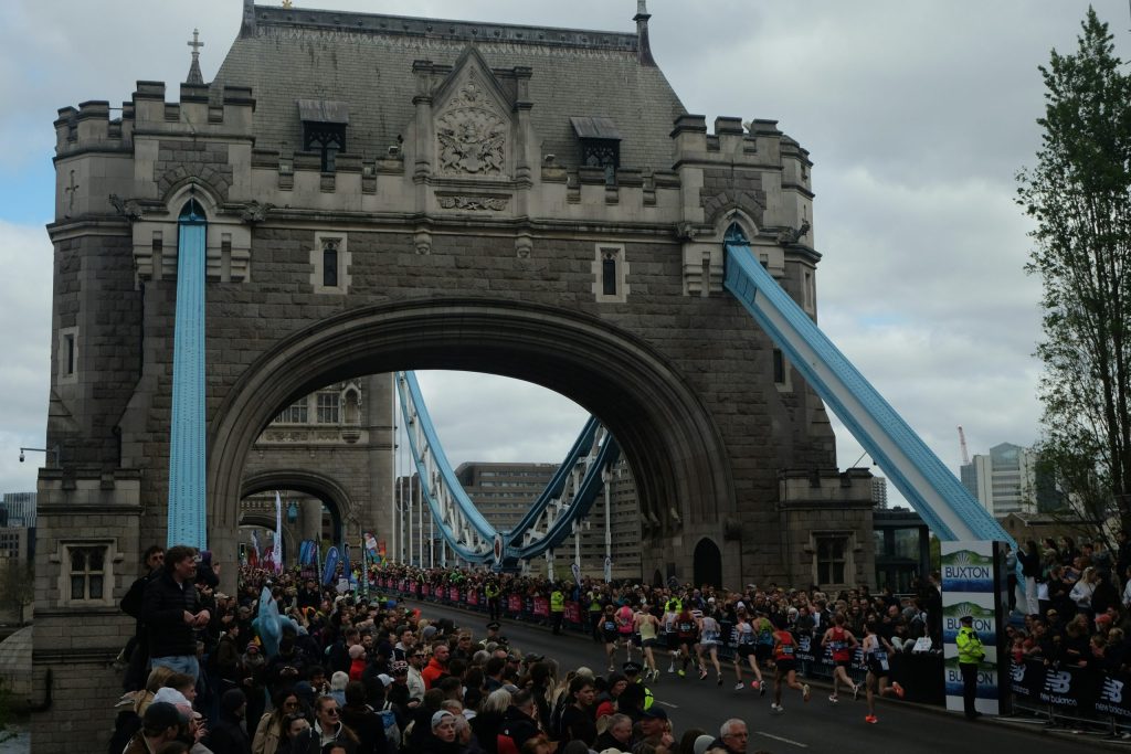 Runners crossing Tower Bridge during the London Marathon (Credit: Free to use from JP Sheard via Unsplash)