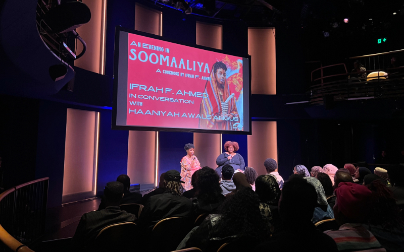 Ifrah F. Ahmed and Haaniyah Awale Angus in conversation on stage in front of an audience