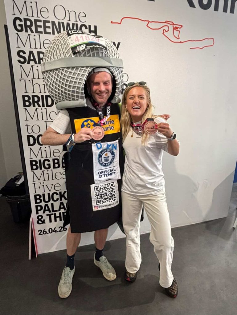 Dan Hudson in his microphone suit and his medal. 