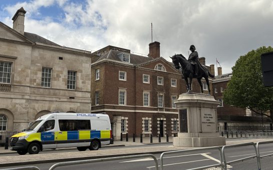 Whitehall statue with police van, London