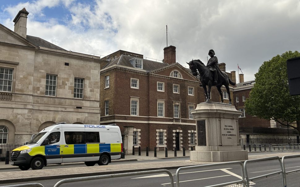 Whitehall statue with police van, London