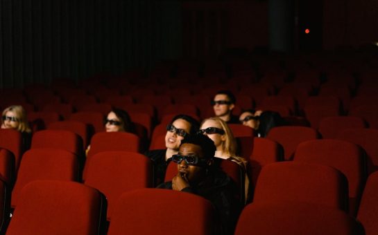 A person sitting in the cinema