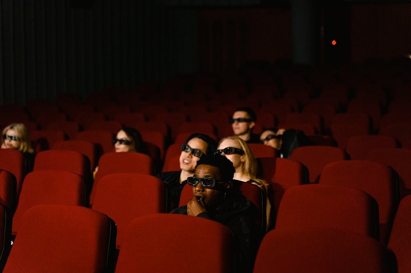 A person sitting in the cinema