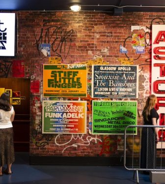 People looking at exhibition posters