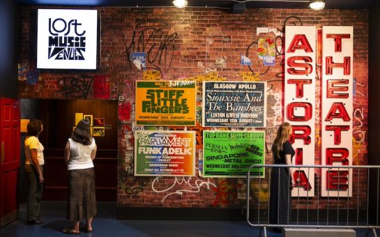 People looking at exhibition posters