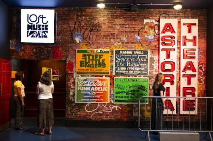 People looking at exhibition posters