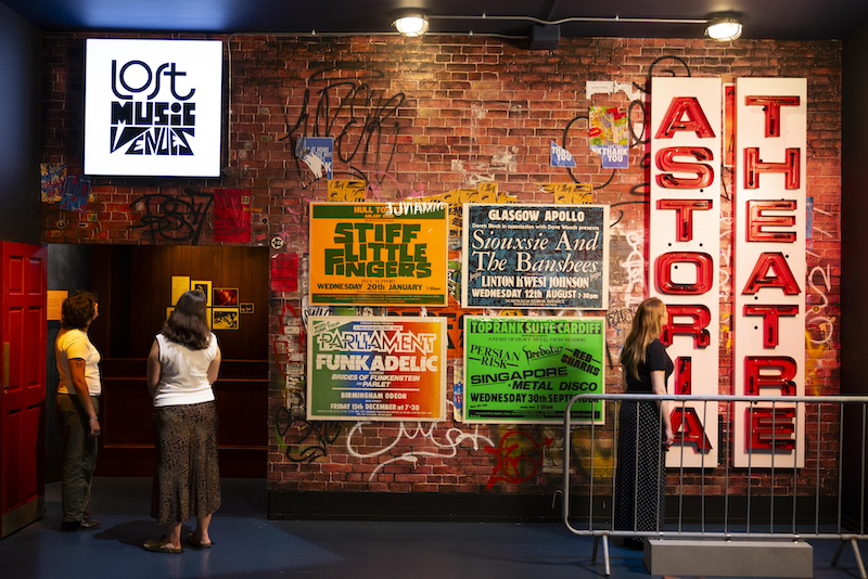 People looking at exhibition posters