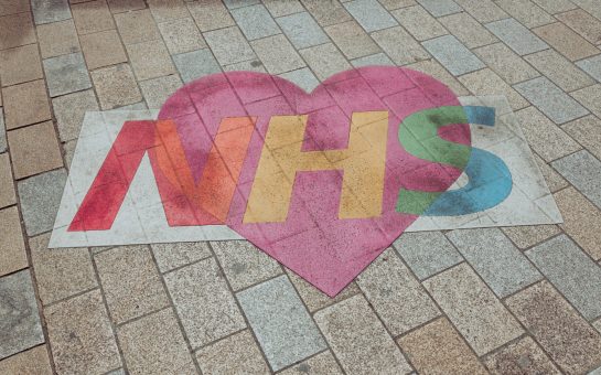 NHS rainbow logo in story about immigration