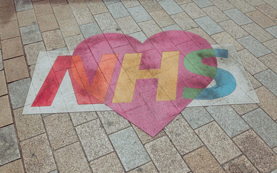 NHS rainbow logo in story about immigration