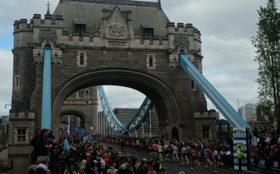 Marathon runners crossing London Bridge