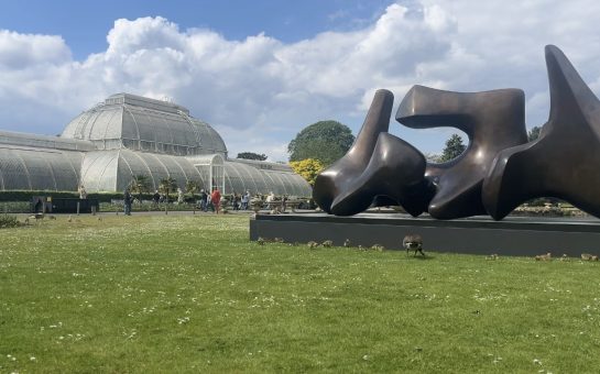 Henry Moore sculpture in front of Kew garden's glass house