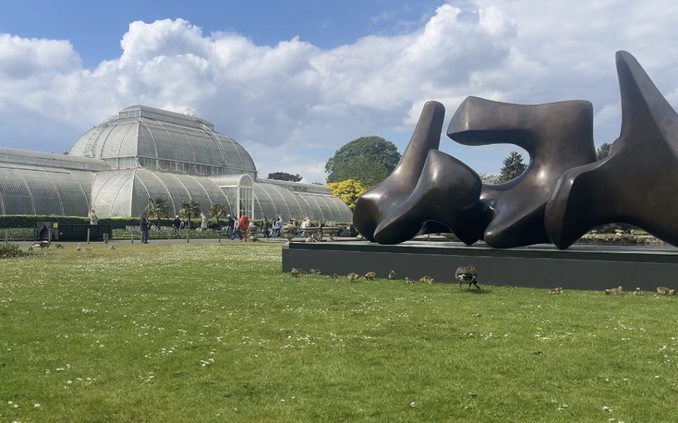 Henry Moore sculpture in front of Kew garden's glass house