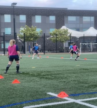Women play football at the Twickenham Swans training ground