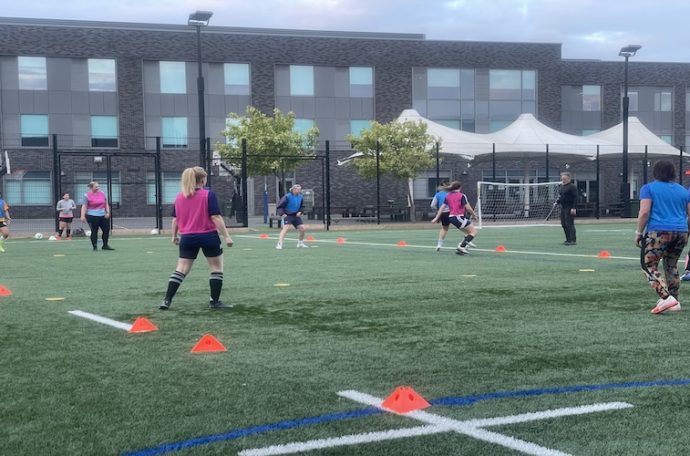 Women play football at the Twickenham Swans training ground
