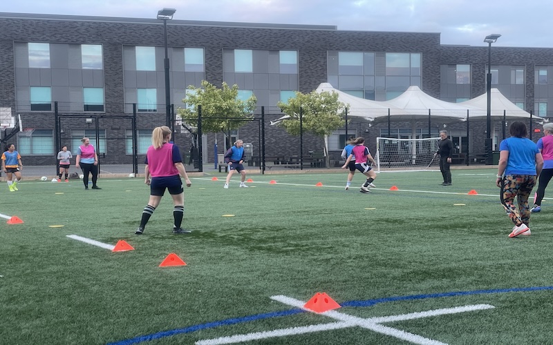 Women play football at the Twickenham Swans training ground