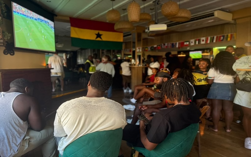Patrons watch the football at the Gold Coast Bar and Restaurant