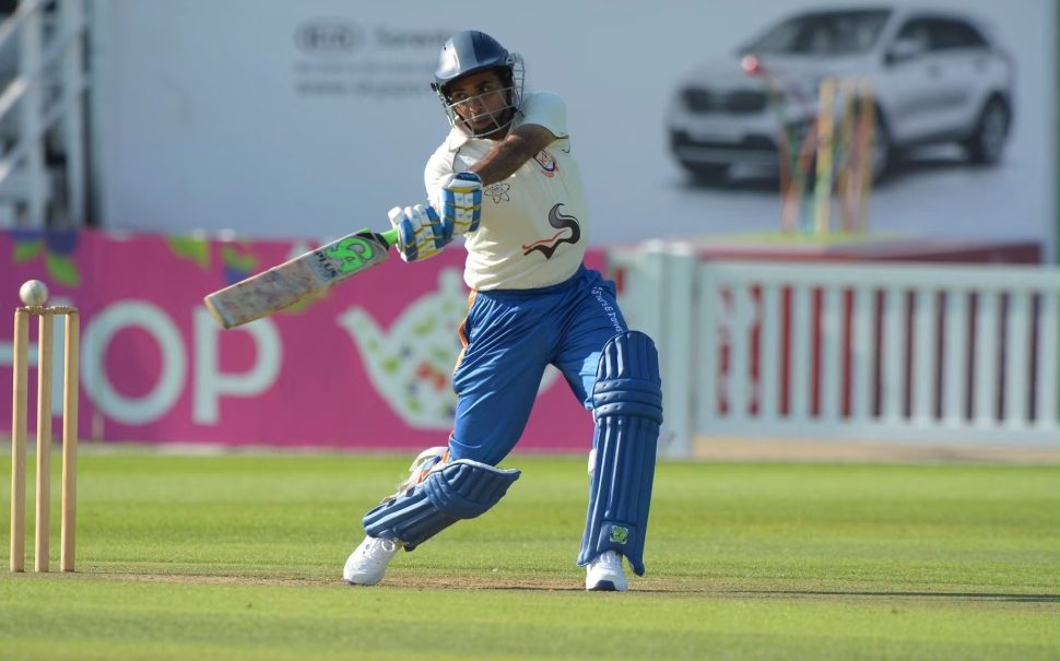 Cricket player playing a shot