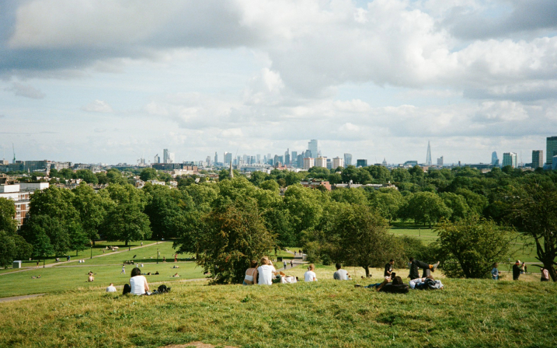 People enjoying the sun at a London park