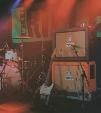 Instrument set up on a stage with bright florescent lights
